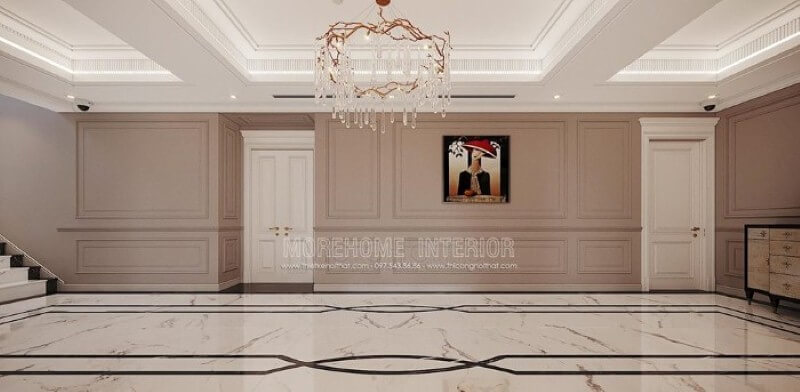 Thiết kế hành lang đẹp ấn tượng với họa tiết độc đáo từ sàn lát đá cùng đường chỉ tường ấn tượng, bức tranh điểm nhấn kết hợp với nét tinh tế từ đèn trần cao cấp. thiết kế nội thất chung cư